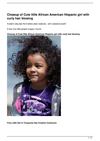 Closeup of Cute little African American Hispanic girl with curly hair blowing